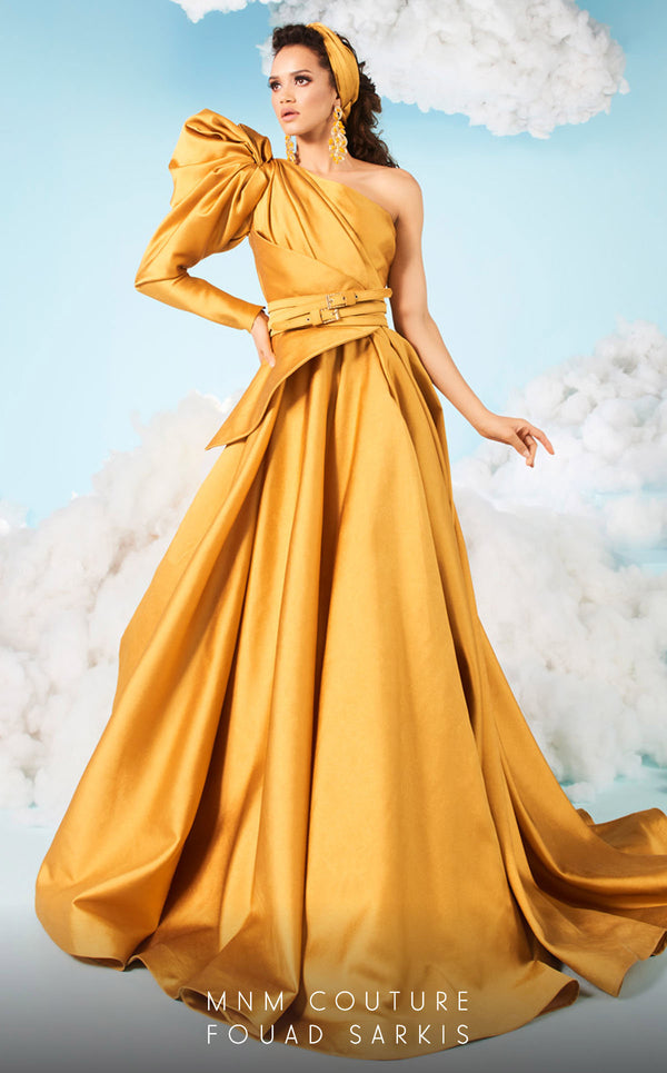 A sophisticated MNM Couture 2636 A-line gown with a one-sleeve design, puffy detail, cinched waist, peplum accents, and a chapel train. Perfect for formal events. | Couture Shop LA