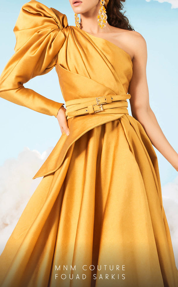 A sophisticated MNM Couture 2636 A-line gown with a one-sleeve design, puffy detail, cinched waist, peplum accents, and a chapel train. Perfect for formal events. | Couture Shop LA