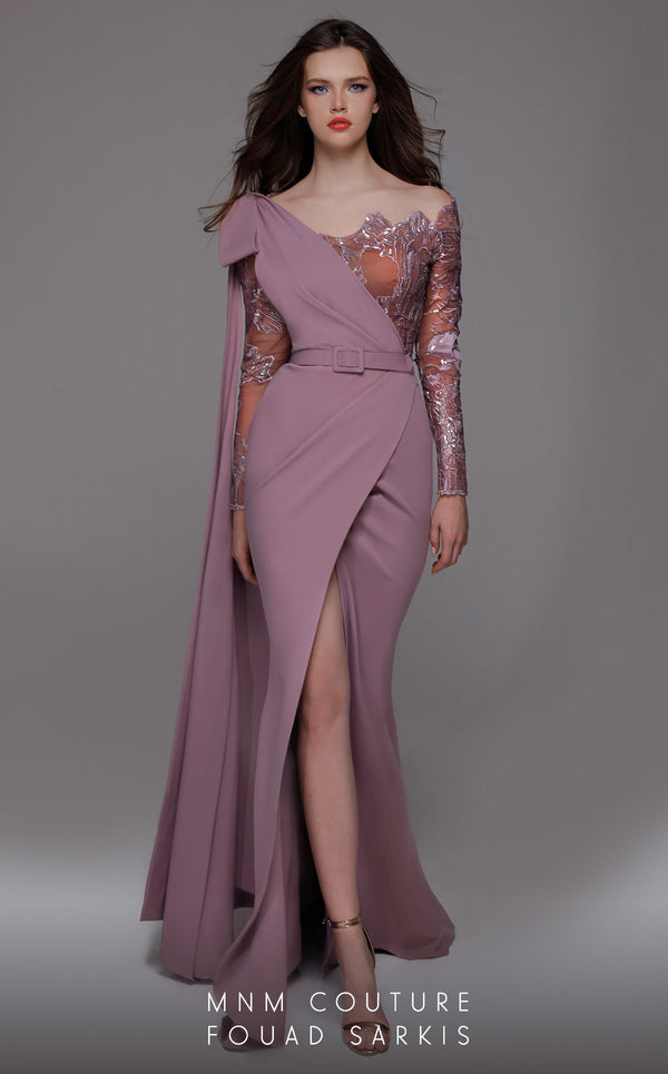 A stunning MNM Couture 2688 sheath gown with a crepe and lace design, asymmetrical neckline, long sleeves, high slit, and an elegant cape. | Couture Shop LA