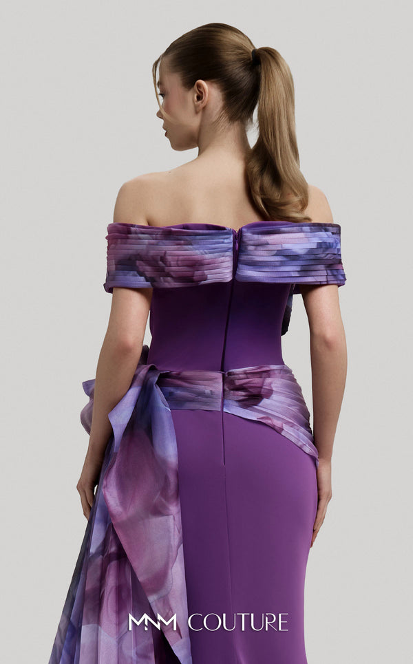 MNM Couture Style 2692A green and lilac mermaid gown with a pleated off-the-shoulder neckline and a ruffled side peplum. | Couture Shop LA