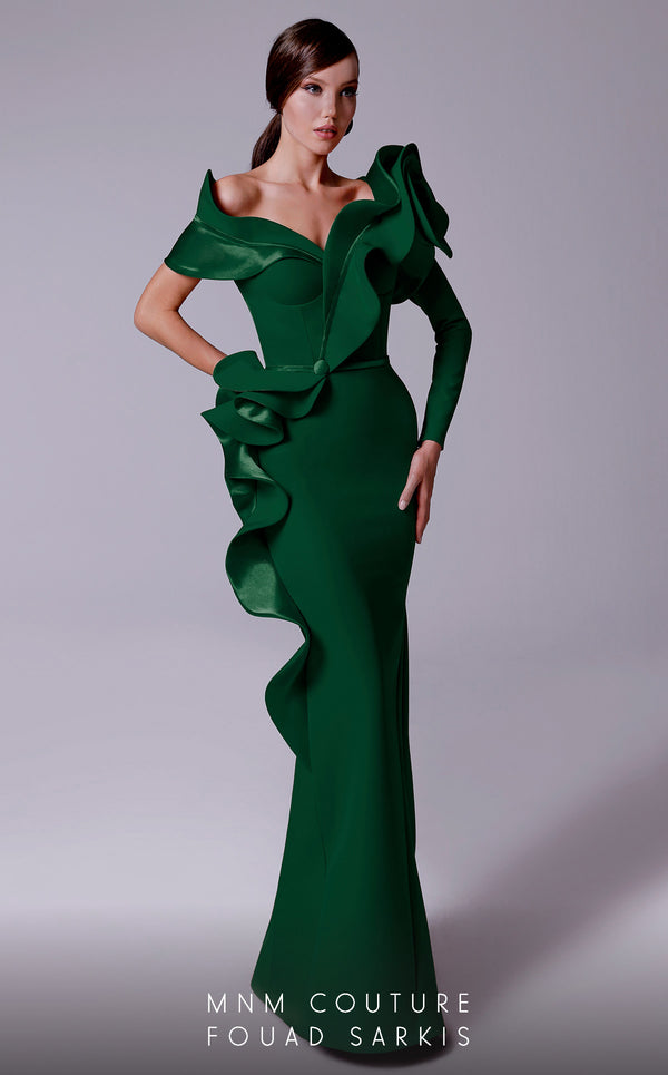 An elegant MNM Couture 2714 satin-crepe mermaid gown featuring long sleeves, ruffled details, a V-neckline, and a rosette accent for added flair. | Couture Shop LA