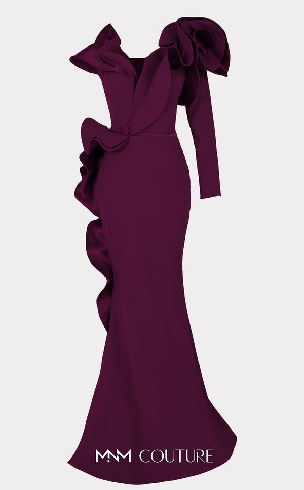 An elegant MNM Couture 2714 satin-crepe mermaid gown featuring long sleeves, ruffled details, a V-neckline, and a rosette accent for added flair. | Couture Shop LA