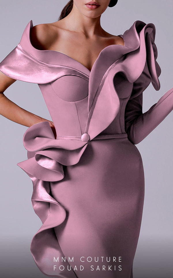 An elegant MNM Couture 2714 satin-crepe mermaid gown featuring long sleeves, ruffled details, a V-neckline, and a rosette accent for added flair. | Couture Shop LA