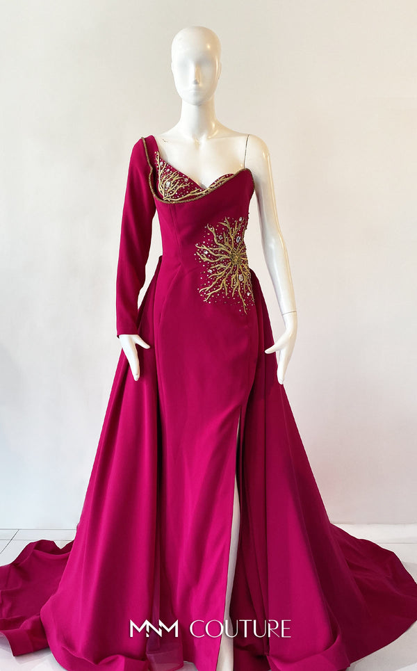A sophisticated MNM Couture 2719 gown with a sweetheart neckline, beaded one long sleeve, high slit, detachable overskirt, and sweeping train. | Couture Shop LA