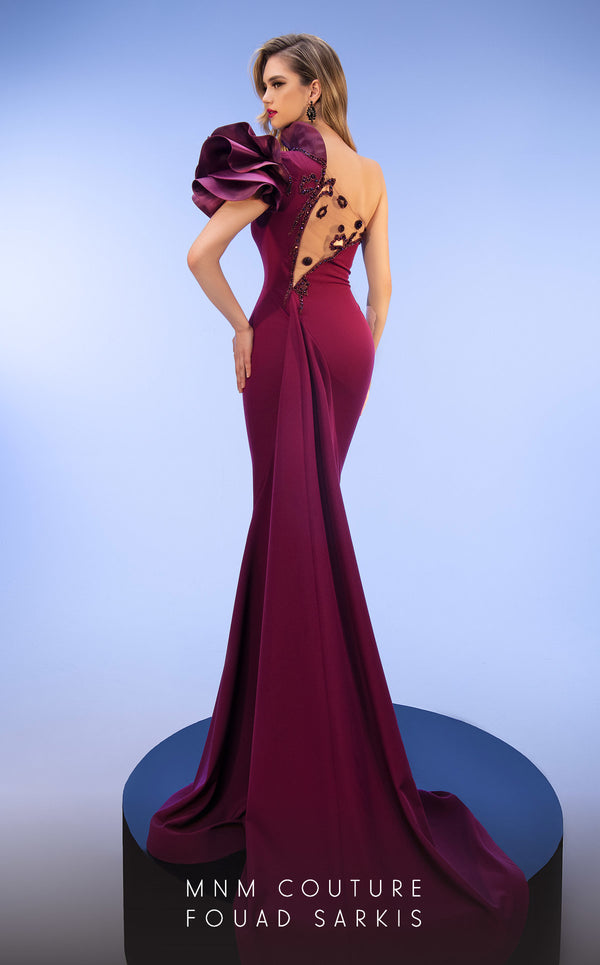 MNM Couture 2736A: Asymmetrical mermaid gown with dramatic ruffles, sparkling embellishments, and a captivating slit. | Couture Shop LA