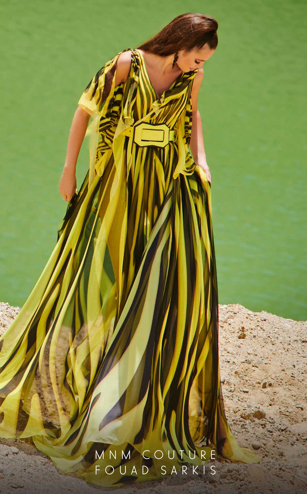 MNM Couture 2748: Sleeveless chiffon jumpsuit with a V-neckline, cinched belt, and flowing wide-leg silhouette. | Couture Shop LA