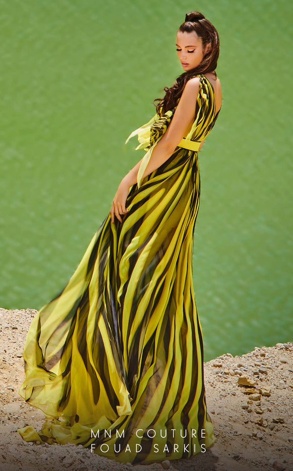MNM Couture 2748: Sleeveless chiffon jumpsuit with a V-neckline, cinched belt, and flowing wide-leg silhouette. | Couture Shop LA