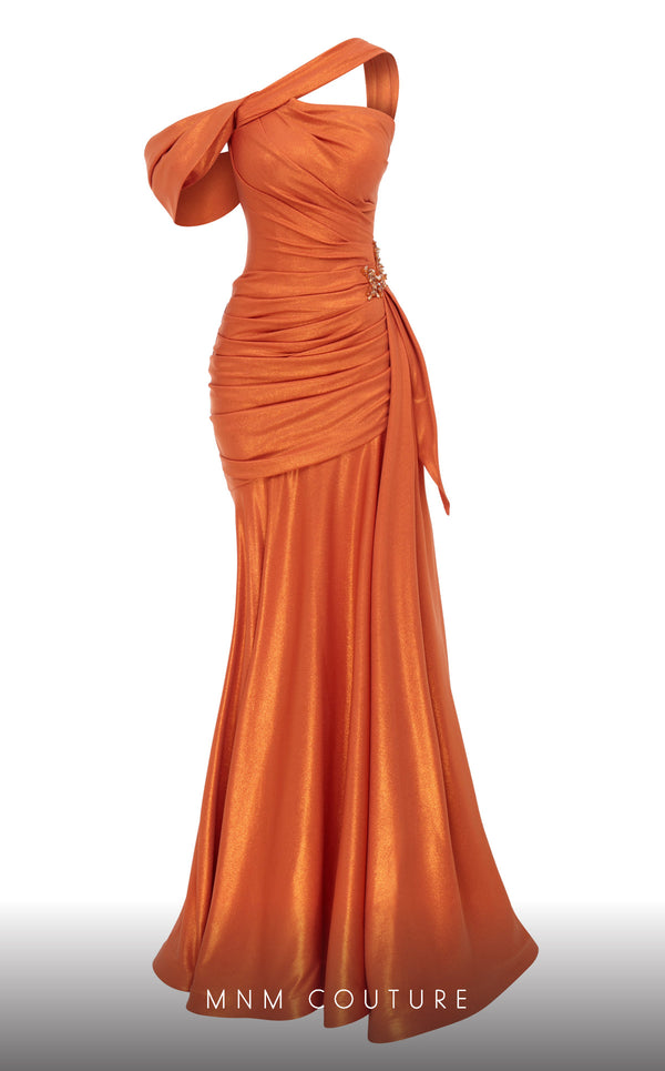MNM Couture 2792: Asymmetrical mermaid evening gown with metallic sheen, bold embellishments, and a captivating silhouette. | Couture Shop LA.
