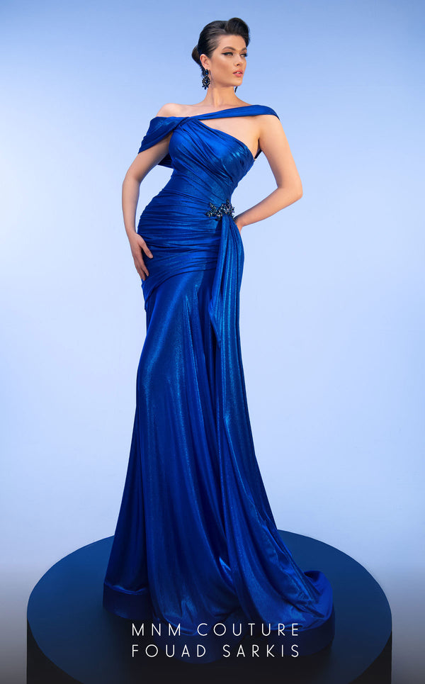 MNM Couture 2792: Asymmetrical mermaid evening gown with metallic sheen, bold embellishments, and a captivating silhouette. | Couture Shop LA.
