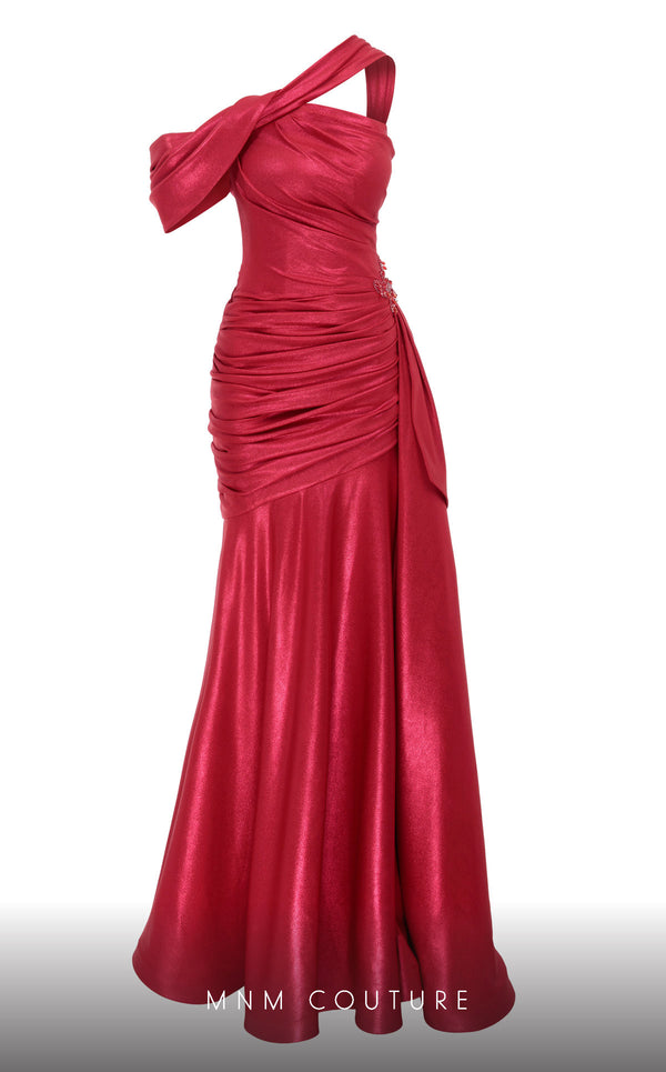 MNM Couture 2792: Asymmetrical mermaid evening gown with metallic sheen, bold embellishments, and a captivating silhouette. | Couture Shop LA.