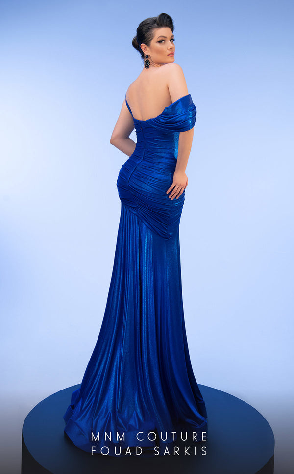 MNM Couture 2792: Asymmetrical mermaid evening gown with metallic sheen, bold embellishments, and a captivating silhouette. | Couture Shop LA.
