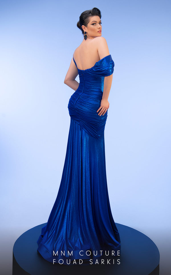 MNM Couture 2792: Asymmetrical mermaid evening gown with metallic sheen, bold embellishments, and a captivating silhouette. | Couture Shop LA.