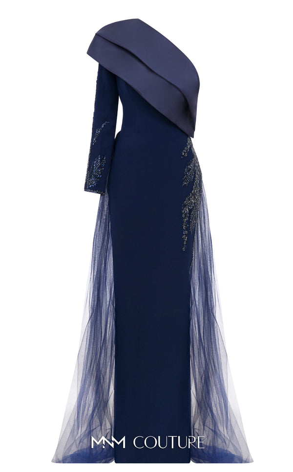 MNM Couture Style B1125 featuring a green organza gown with strap sleeves, a floral-embellished strap, cascading pleats, a V-neckline, and a flowing train.| Couture Shop LA.