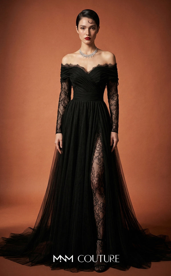 MNM Couture Style B1141 featuring a flared black organza gown with an off-the-shoulder sweetheart neckline, long sleeves, and a long, flowing train cape at the back.| Couture Shop LA.