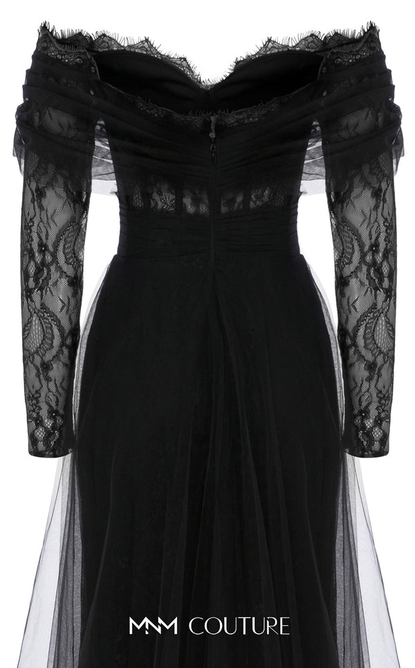 MNM Couture Style B1141 featuring a flared black organza gown with an off-the-shoulder sweetheart neckline, long sleeves, and a long, flowing train cape at the back.| Couture Shop LA.
