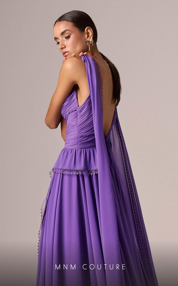 MNM Couture Style E0086 showcasing a flared silk gown with a V-neckline, sleeveless design, pleated bust, and long capes falling from the shoulders to create a train. | Couture Shop LA