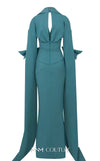 MNM Couture Style E0094 gown with cape sleeves, a collar neckline, and a striking side slit. / Couture Shop LA