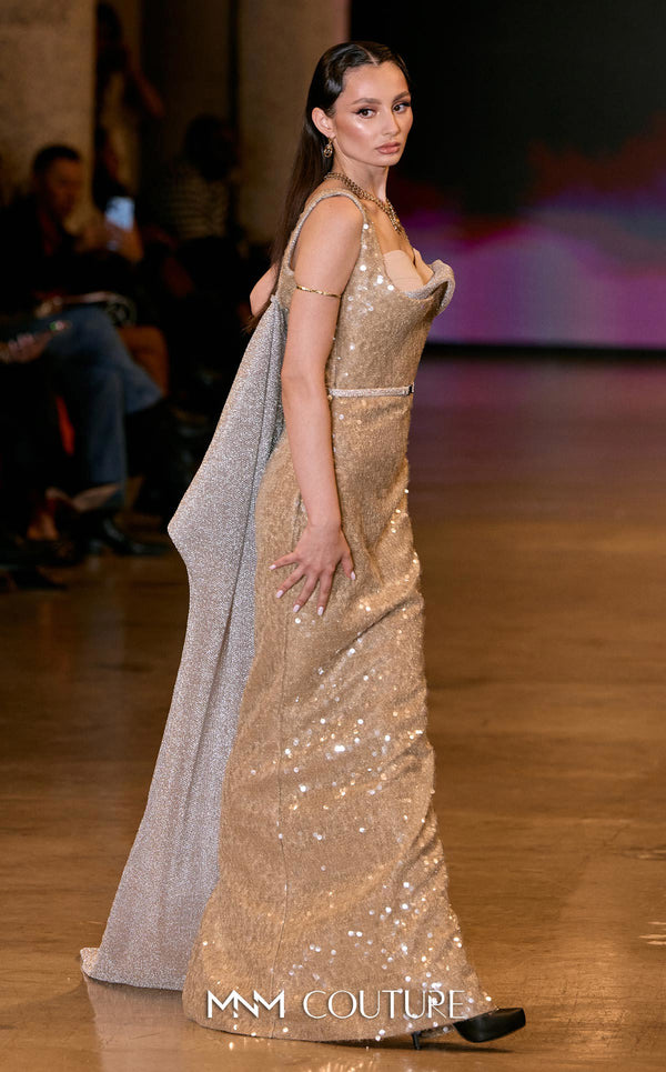 MNM Couture E0108 sequin-embellished fitted column gown with strap sleeves, asymmetric sweetheart neckline, and a flowing cape with a train. | Couture Shop LA