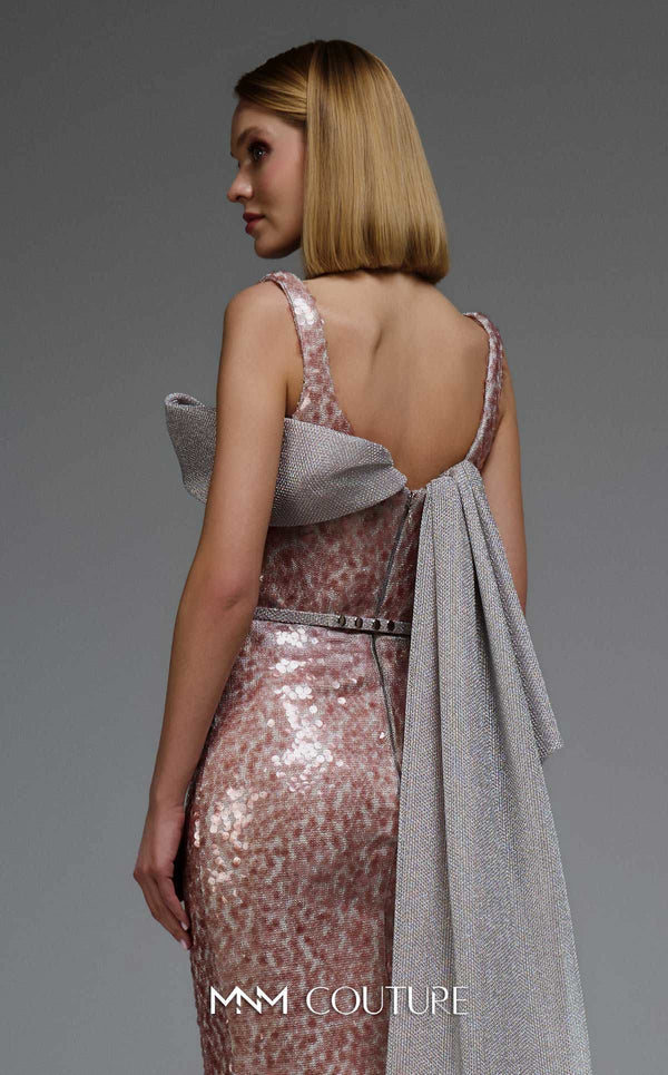 MNM Couture E0108 sequin-embellished fitted column gown with strap sleeves, asymmetric sweetheart neckline, and a flowing cape with a train. | Couture Shop LA