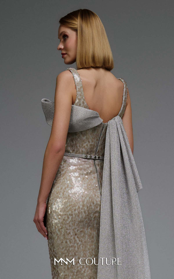 MNM Couture E0108 sequin-embellished fitted column gown with strap sleeves, asymmetric sweetheart neckline, and a flowing cape with a train. | Couture Shop LA