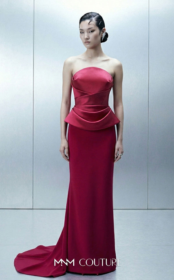 MNM Couture E0146 strapless draped satin mermaid gown with arched neckline, darted bust, illusion peplum, crisscross waist, and dramatic back train | Couture Shop LA.