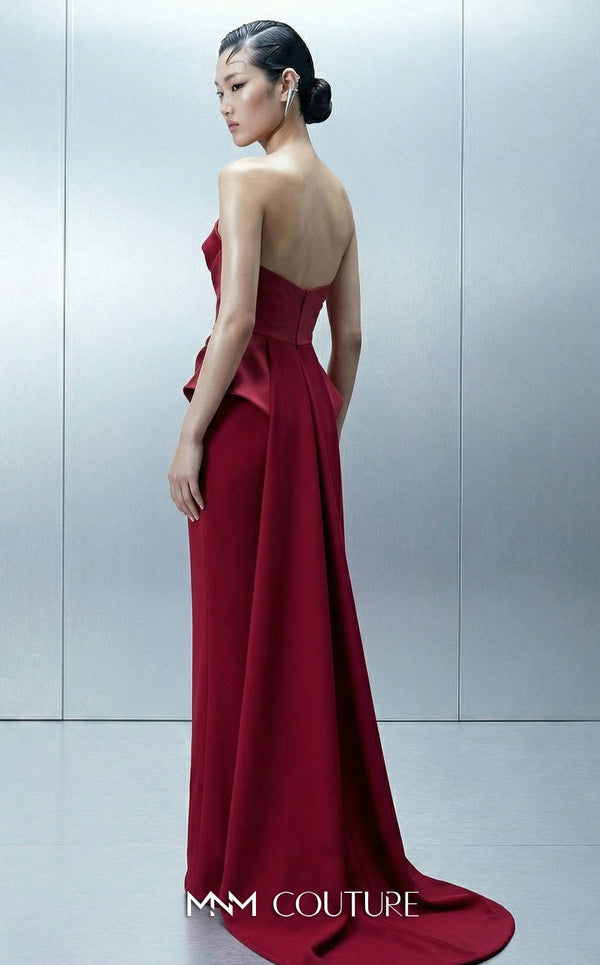 MNM Couture E0146 strapless draped satin mermaid gown with arched neckline, darted bust, illusion peplum, crisscross waist, and dramatic back train | Couture Shop LA.