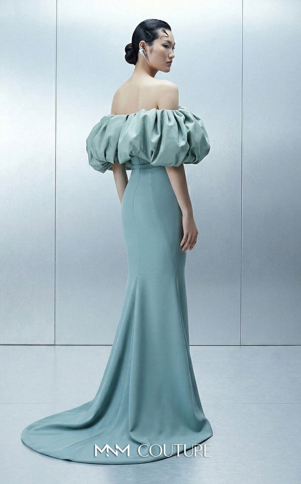Long straight fitted crepe dress featuring an asymmetrical bodice and puffy taffeta sleeves for MNM Couture Style E0165 | Couture Shop LA.