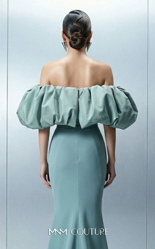 Long straight fitted crepe dress featuring an asymmetrical bodice and puffy taffeta sleeves for MNM Couture Style E0165 | Couture Shop LA.