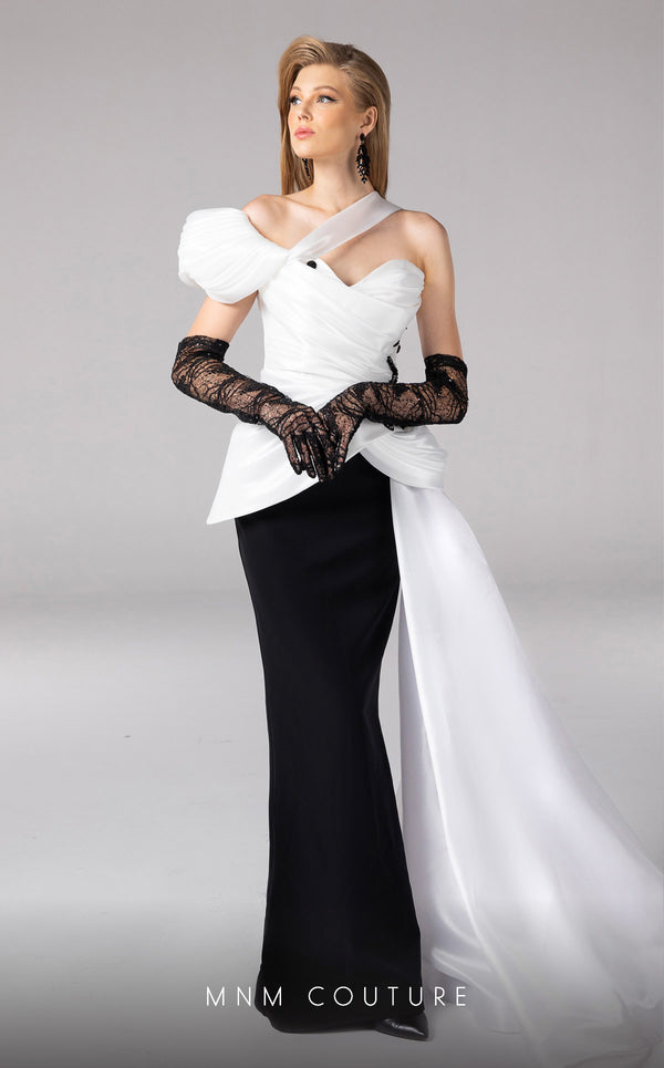 MNM Couture F02810 gown crafted from luxurious satin and crepe, featuring an asymmetrical design with an off-shouldered sleeve, draped bust with embroidery and tassels, and a stylish side tail, perfect for evening events or red carpet appearances | Couture Shop LA
