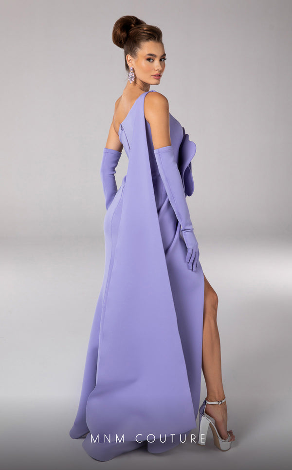 Discover the essence of evening sophistication with the MNM Couture F02826, a luxurious crepe gown embellished with a classical rose, tailored for the exclusive tastes of red carpet and special occasion aficionados. | Couture Shop LA