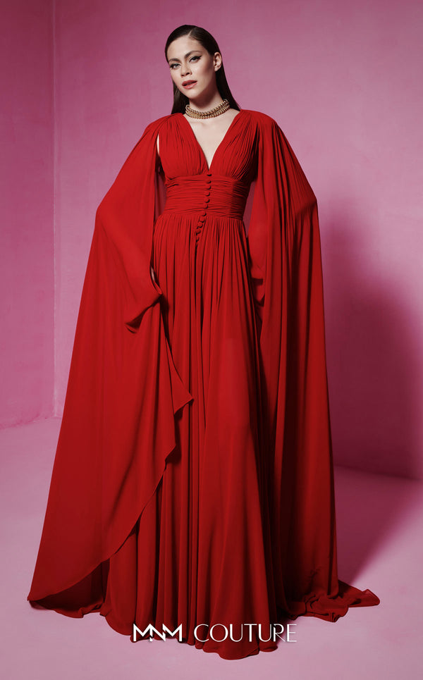 MNM Couture Style F02845 red evening dress with cape-style long sleeves, V-neckline, tailored waistline adorned with buttons, and long flowing train | Couture Shop LA.