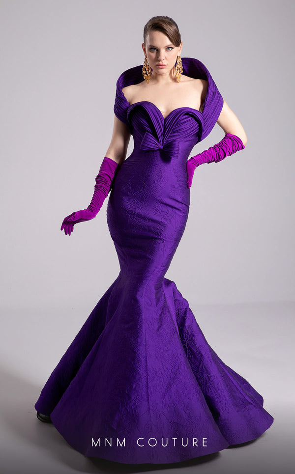 MNM Couture Style F02901 dress showcasing a pleated sweetheart neckline, mid-bow detail, and a stunning mermaid silhouette. / Couture Shop LA
