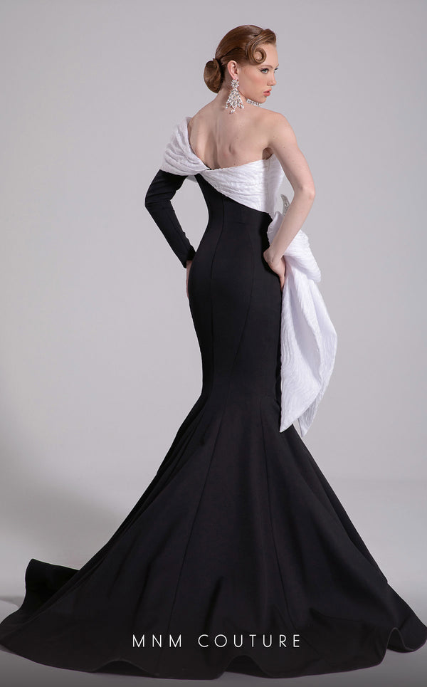 MNM Couture Style F02907 featuring an asymmetric mermaid gown with a large pleated organza bow, one off-shoulder cap sleeve, and crystal embellishments on the bodice. | Couture Shop LA