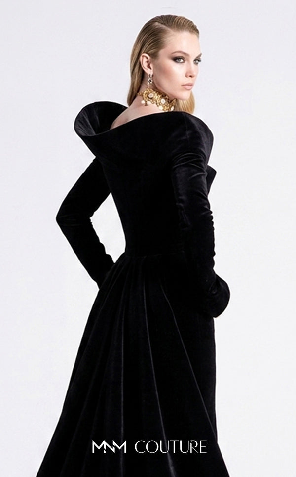 Couture Shop LA F02910B black velvet long-sleeve column gown with open asymmetric neckline, angular left shoulder cap, high back collar, flared cuffs, and gathered back train | Couture Shop LA