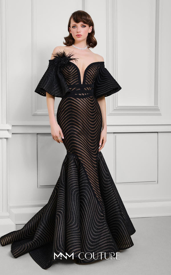 MNM Couture Style F02925 - Elegant black mesh mermaid gown featuring off-shoulder ruffled bell sleeves, a deep V-neckline, and a plumage brooch. | Couture Shop LA