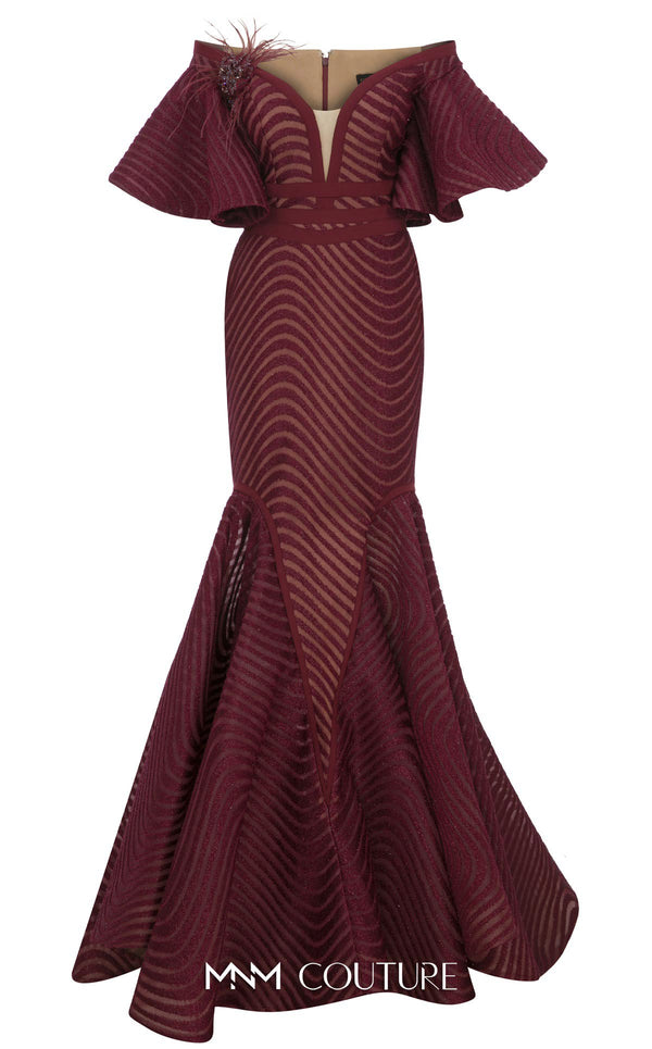 MNM Couture Style F02925 - Elegant black mesh mermaid gown featuring off-shoulder ruffled bell sleeves, a deep V-neckline, and a plumage brooch. | Couture Shop LA