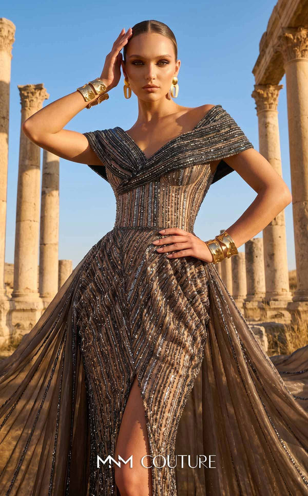 MNM Couture Style F02929 showcasing a dramatic off-the-shoulder A-line gown with dark sequin and bead embellishments and a full, vertically striped tulle overlay. | Couture Shop LA