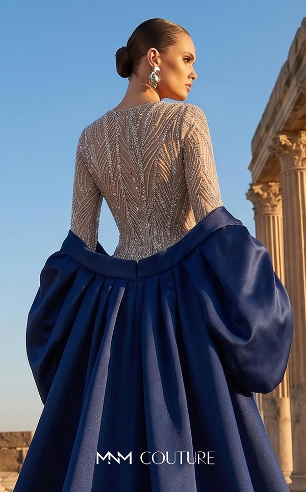 MNM Couture F03004 embroidered sequin mermaid gown with contrasting satin long cape, puffy sleeves, small train, and fitted silhouette | Couture Shop LA.