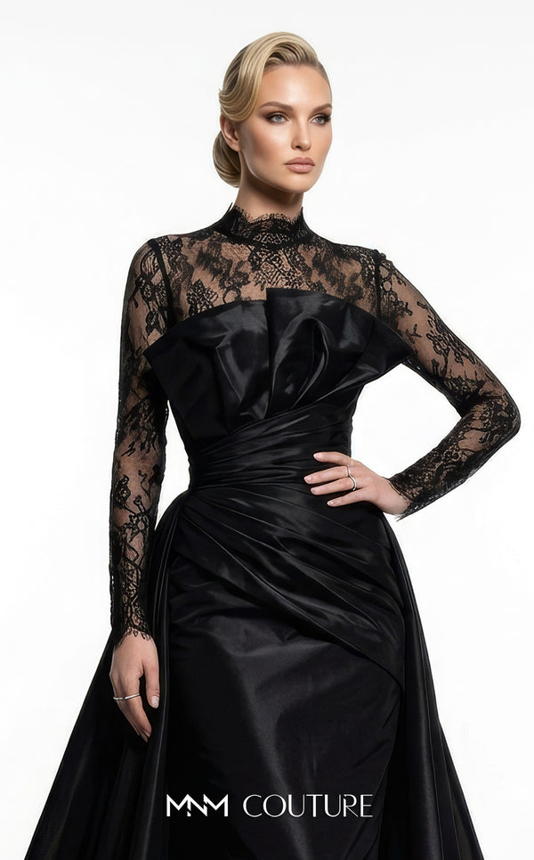 MNM Couture F03006A Chantilly lace and satin column gown featuring a high lace collar, sheer long sleeves, a 3D shoulder bow, an asymmetric ruched waist belt, stomach draping, and an open-front A-line overskirt | Couture Shop LA