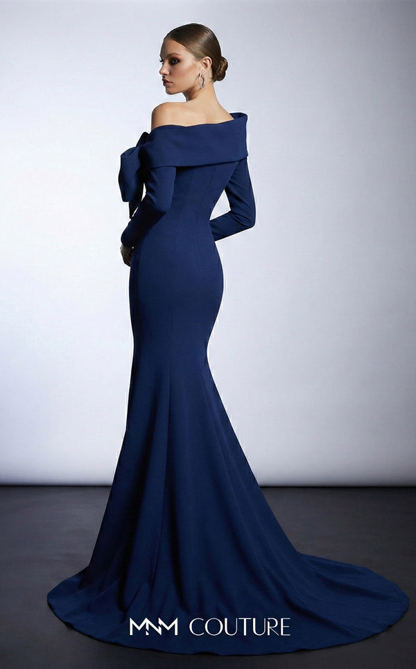 MNM Couture F03007 mint crepe long-sleeve mermaid gown with asymmetric large folded boat neckline, bare left shoulder, and oversized flat sculptural bow at the bust | Couture Shop LA