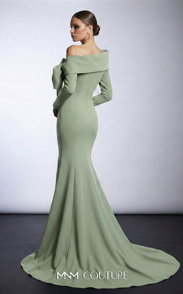 MNM Couture F03007 mint crepe long-sleeve mermaid gown with asymmetric large folded boat neckline, bare left shoulder, and oversized flat sculptural bow at the bust | Couture Shop LA