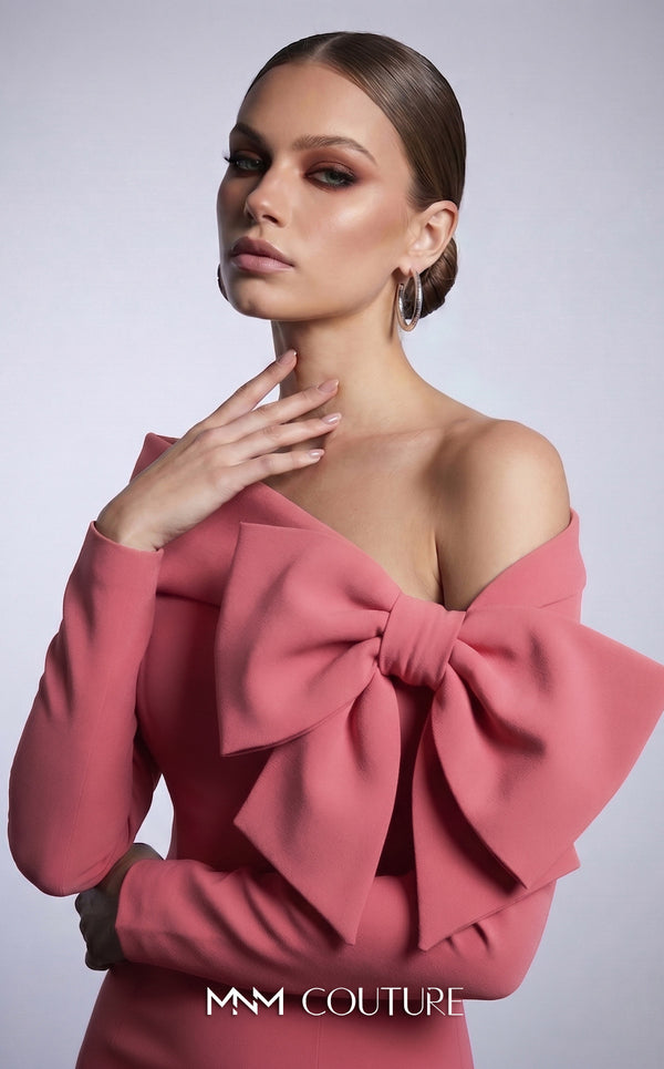 MNM Couture F03007 mint crepe long-sleeve mermaid gown with asymmetric large folded boat neckline, bare left shoulder, and oversized flat sculptural bow at the bust | Couture Shop LA