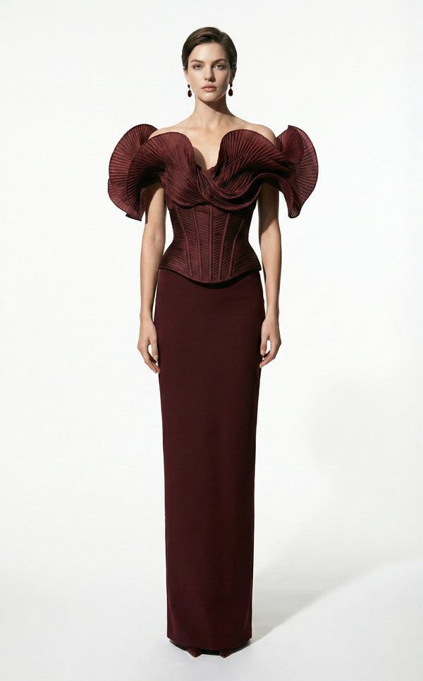 MNM Couture F03032 crepe column gown with off-shoulder draped sweetheart neckline, bilateral accordion-pleated fan ruffles, structured boned corset, and center-back slit | Couture Shop LA.