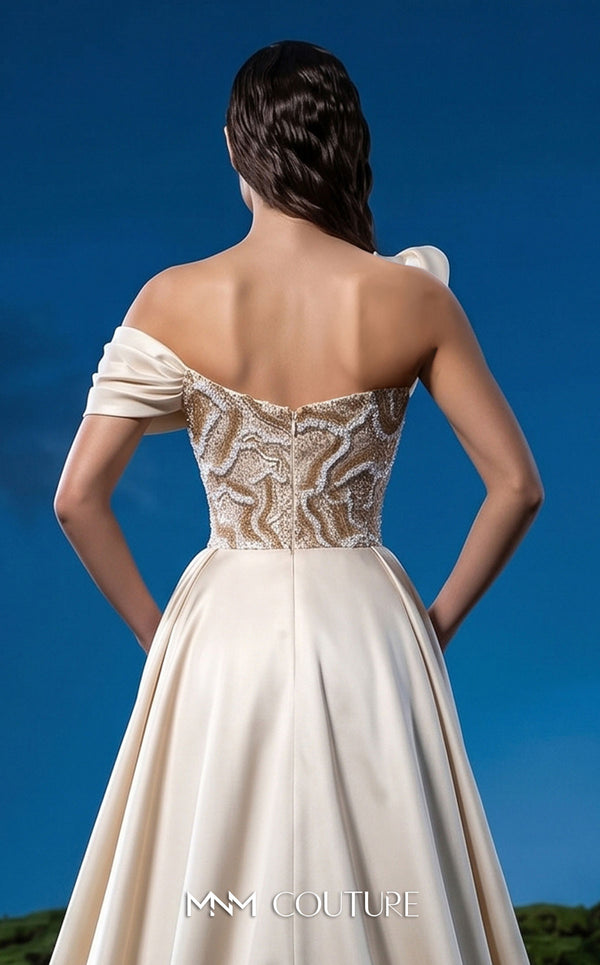MNM Couture F03044 navy duchess satin gown with diagonal off-shoulder drape, sculptural right-shoulder petal, multicolor sequin-embroidered column, open-front A-line overskirt, and open back | Couture Shop LA.