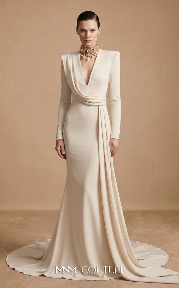 MNM Couture F03046 cherry red crepe long-sleeve column gown with structured shoulders, deep plunging V-neckline, and Roman écharpe drape from right shoulder to cascading left side panel | Couture Shop LA
