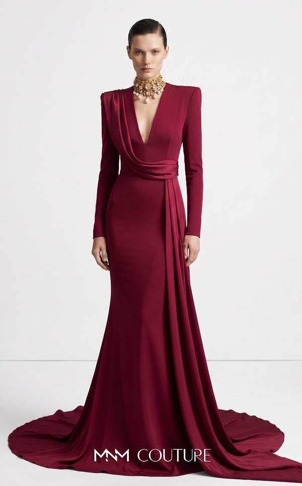 MNM Couture F03046 cherry red crepe long-sleeve column gown with structured shoulders, deep plunging V-neckline, and Roman écharpe drape from right shoulder to cascading left side panel | Couture Shop LA