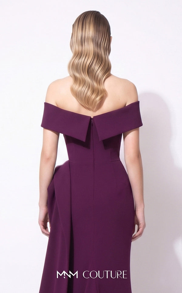 MNM Couture F03064 deep magenta crepe column gown with off-shoulder deep V cap bands, low open back, and oversized sculptural fin peplum at the left hip cascading into a side train | Couture Shop LA
