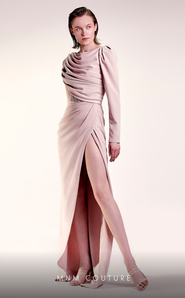 MNM Couture G1408 one-sleeve crepe column gown with boatneck neckline, rhinestone corseted waist, and draped floor-length skirt with slit | Couture Shop LA.