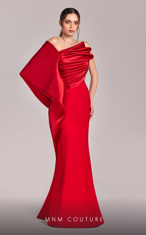 MNM Couture G1803 gown featuring a sleek mermaid silhouette, organza draping, and an exaggerated one-shoulder sleeve. | Couture Shop LA