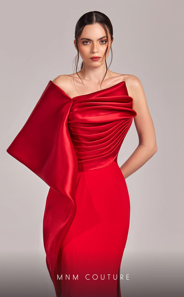MNM Couture G1803 gown featuring a sleek mermaid silhouette, organza draping, and an exaggerated one-shoulder sleeve. | Couture Shop LA